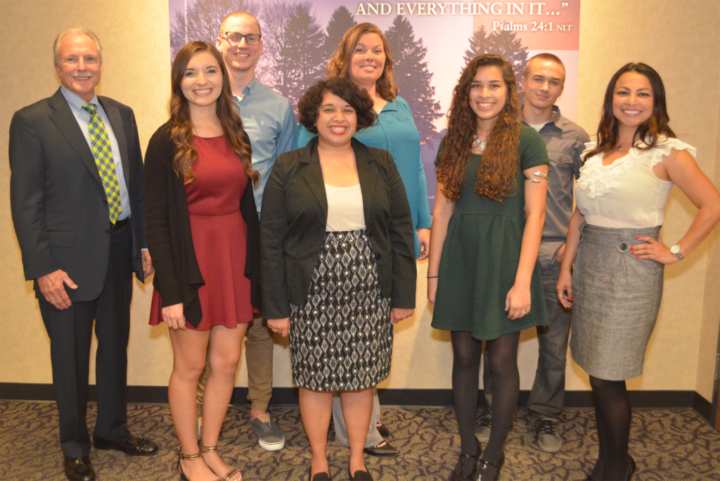 John Walling, Christian Community Credit Union President/CEO (L), along with Suzanne Ramirez, Christian Community Credit Union Membership Development Representative (R), pose with 2016 “Scholarships for Success” recipients (front row L-R) Cassandra MacQuoid, Elizabeth Sotelo, Victory Ali, (back row L-R) Cole Curry, Julie Bocock, and Cole Lindsay.