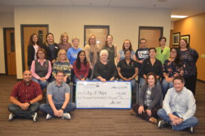 Staff with City of Hope check