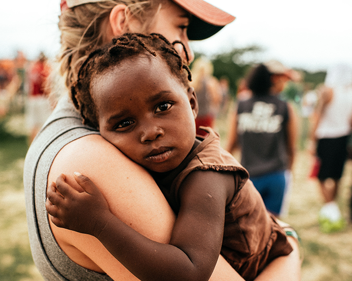 cccu missionvolunteer with child 690x550