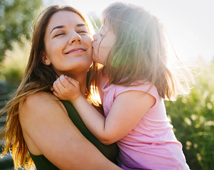 Mom with Special Needs Child enjoying outdoors and harvest