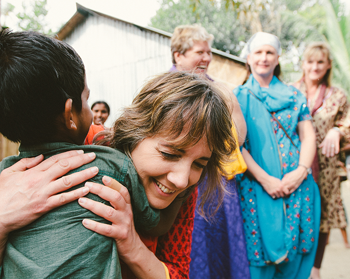 Missionary Woman Hugging Child