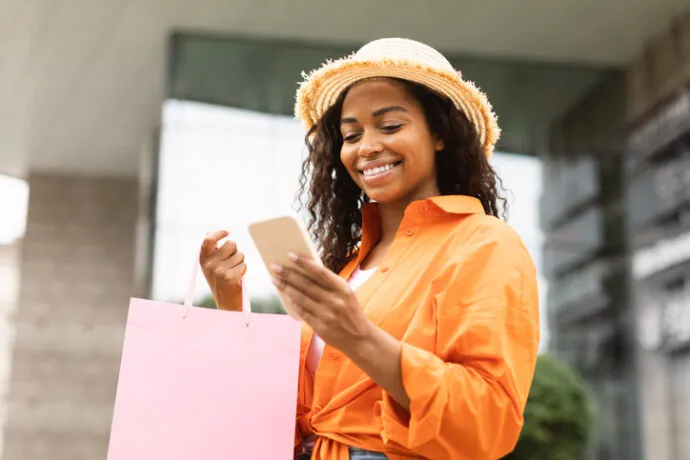 lady with mobile and bag